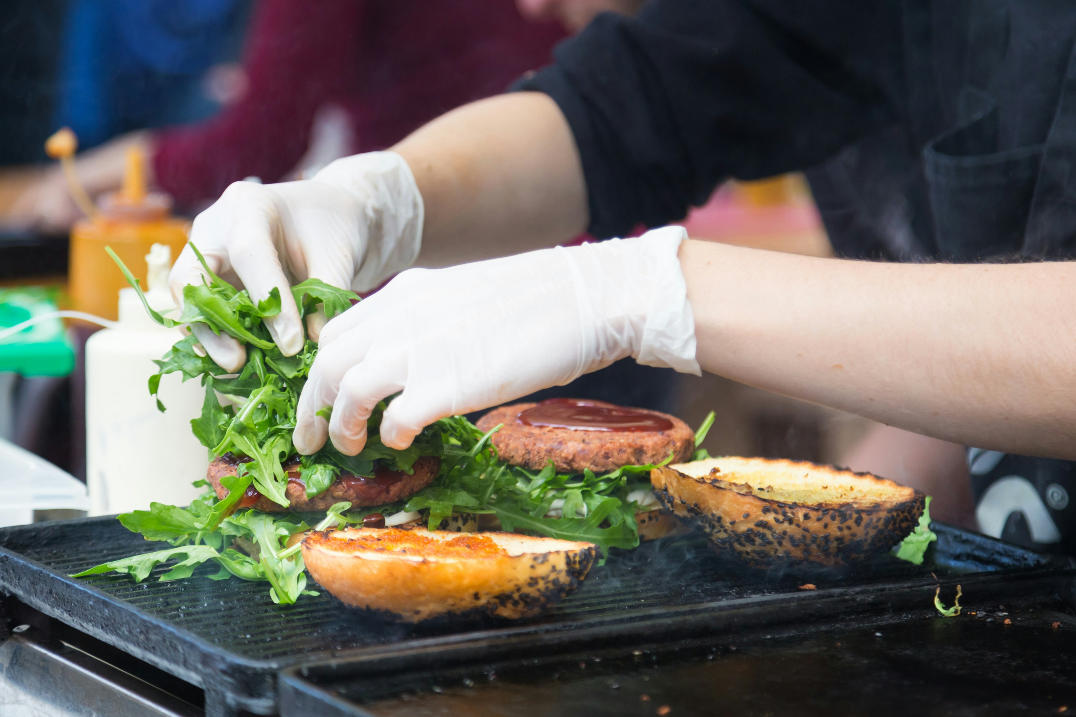 Chef Making a Burger Wearing Gloves