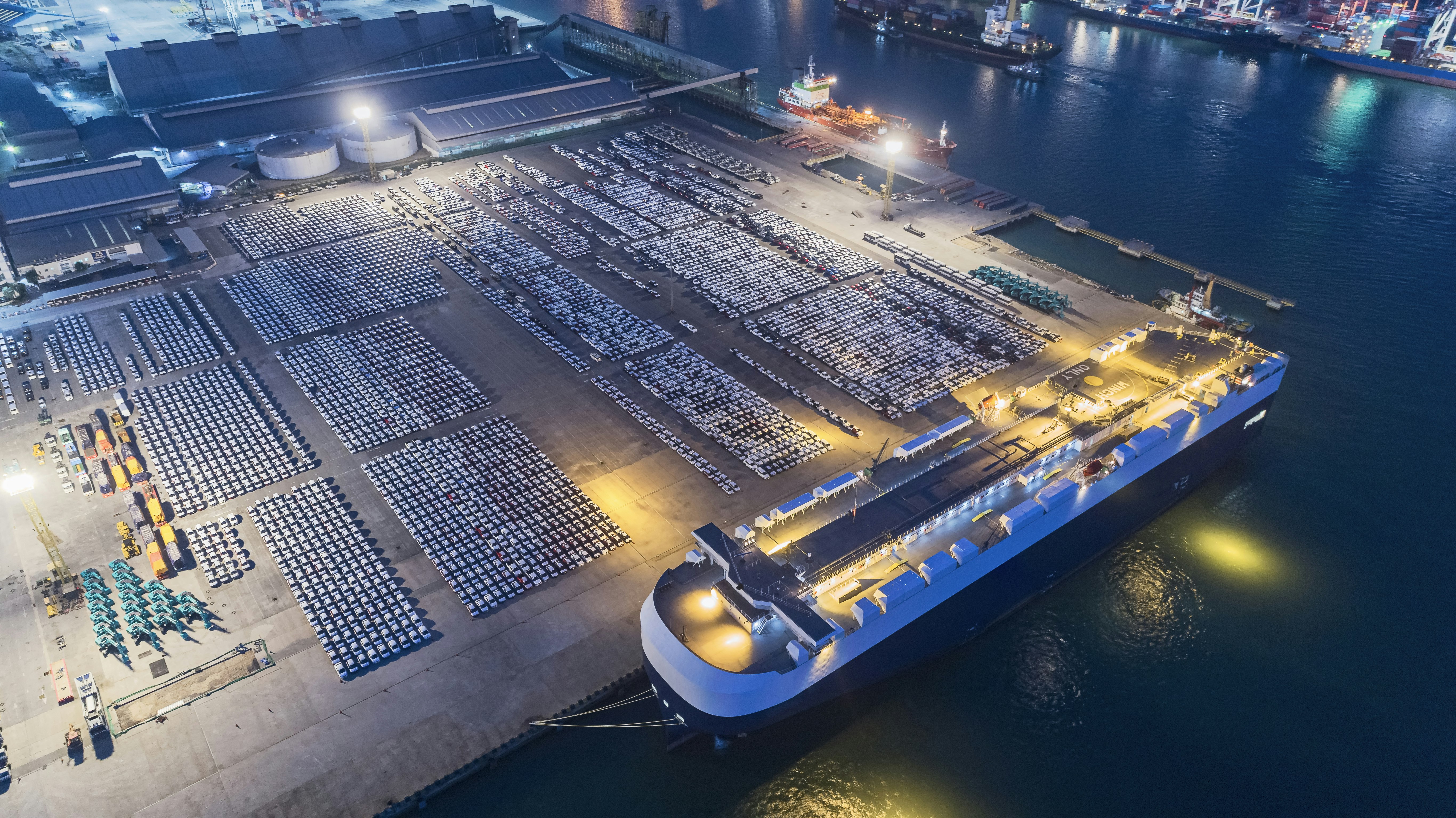 Aerial View of Carrier Vessels Loading Cars and Trucks