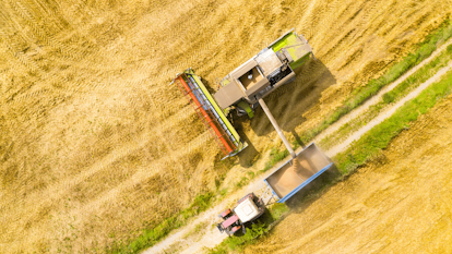 Tractor Harvesting Grain in Crop Field 1600px